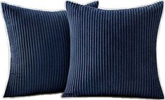 two blue corded pillows sitting next to each other