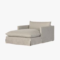 a white couch with a gray pillow on it's back and the seat upholstered