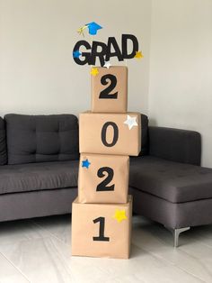 graduation decorations made out of cardboard boxes on the floor