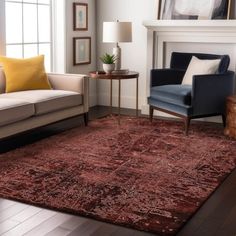 a living room filled with furniture and a red rug on top of a hard wood floor