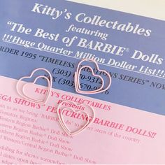 two pink heart shaped earrings on top of a blue and white brochure with the words kitty's collectables