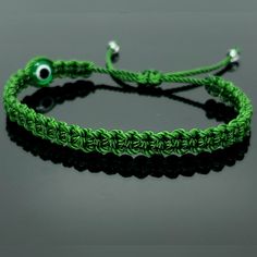 Fashionable And Durable Hand-Made Green String Bracelet With An Evil Eye For Wrist Sizes From 6 To 9 In, With An Easy To Use Zip Like Function To Fit Your Wrist, You'll Have It On As Soon As You Get It. Made From High Quality Green String, It Will Be Sure To Last. These Bracelets Are Worn To Attract Good Fortune, Bring A Good Mood And To Ward Off Bad Vibes. The Evil Eye Meaning Has Symbolism In Almost Every Country In The World And In Every Religion. Each Bracelet Is Carefully Handcrafted And Gi Adjustable Green Macrame Bracelets, Handmade Casual Band Bracelet, Green Casual Bracelets With Adjustable Cord, Green Casual Bracelet With Adjustable Cord, Green Friendship Bracelets With Sliding Knot, Trendy Handmade Green Braided Bracelets, Adjustable Trendy Green Wristband, Trendy Adjustable Green Wristband, Trendy Handmade Green Braided Bracelet