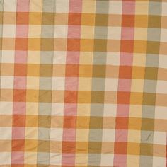 an orange, yellow and white checkered bed spread