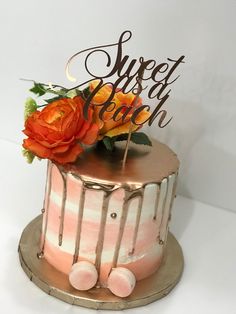 there is a cake that has been decorated with flowers and the words sweet as peach on top