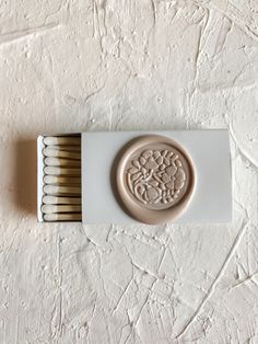 a matchbox with matches in it on a white surface