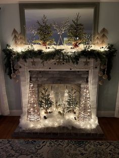 a fireplace decorated with christmas decorations and lights