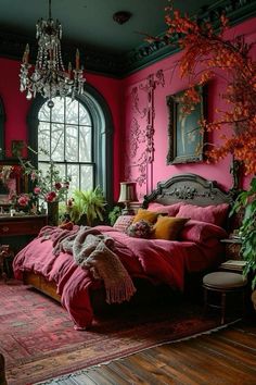 a bedroom decorated in pink and green with a chandelier hanging from the ceiling