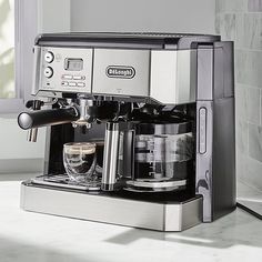 an espresso machine is sitting on the counter