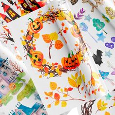 many different designs and colors of paper with pumpkins, leaves and bats on them