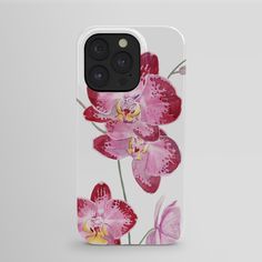 an iphone case with pink orchids and butterflies on the front, against a white background