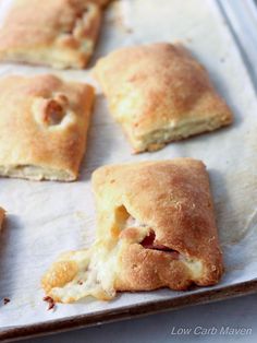 several pastries are sitting on a baking sheet