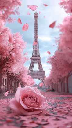 the eiffel tower is surrounded by pink trees and petals in front of it