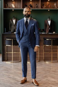 Man in Blue check mens three piece suit paired with a light blue stripped shirt, navy blue tie, light blue pocket square and brown shoes. 3 Piece Suits, Blue Check