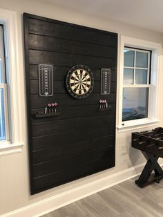 a dart board mounted to the side of a wall