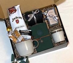 an open box containing coffee, cookies and other items