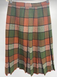 Vintage 100% Wool Plaid Pleated Skirt W/Union Tag Green/Orange  This vintage wool skirt comes in good used condition, with little signs of use and wear. This skirt does not have a size tag and measure approximately 11.5" across the waist, 26" from top to bottom. Please see photos as they are part of the description and exact condition details. Thank you for looking. Orange Plaid Skirt, Vintage Wool Skirt, Plaid Pleated Skirt, Orange Plaid, Wool Skirt, Plaid Skirt, Wool Skirts, Plaid Skirts, Wool Plaid