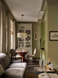 a living room filled with furniture and a table