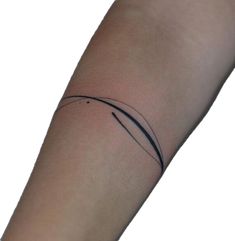 a woman's arm with a small tattoo design on the left side of her arm