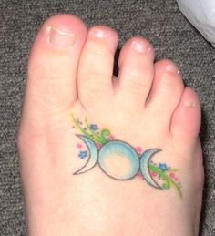 a person has a tattoo on their foot