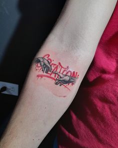 a person with a tattoo on their arm