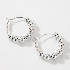 Finish off your look with these shiny beaded huggie earrings designed with a bright, versatile silver-plated finish. 1.7" diameter Silver-plated copper Nickel-free Metal Hoop Beaded Earrings, Silver Sterling Hoop Earrings With Dangling Beads, Trendy Nickel-free Beaded Hoop Earrings, Silver Metal Beaded Hoop Earrings, Trendy Nickel-free Silver Beaded Earrings, Trendy Silver Nickel-free Beaded Earrings, Trendy Nickel-free Beaded Earrings With Round Beads, Silver Hoop Beaded Jewelry, Silver Beaded Hoop Earrings In Sterling Silver