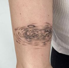 a person with a tattoo on their arm