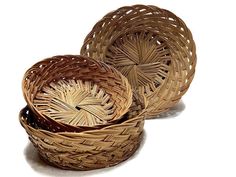 three wicker baskets sitting next to each other