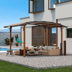 an outdoor living area with couches and tables next to a pool in front of a house