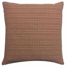 a brown and tan pillow with a checkered pattern on the front, sitting against a white background