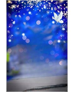 a white bird flying over a blue background with snowflakes and stars in the sky