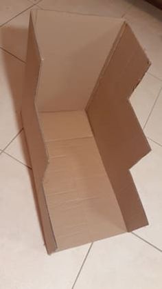 an open cardboard box sitting on the floor