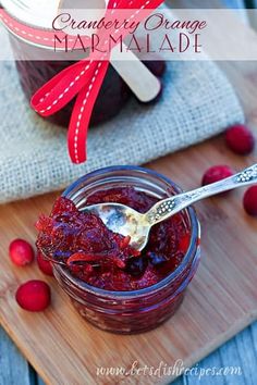 cranberry orange marmalade in a jar with a spoon