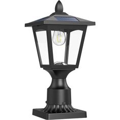 an outdoor light with a solar panel on top