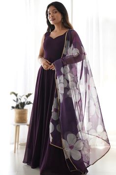 This purple georgette anarkali suit will keep you comfortable and easy on the eye at the next social function.This sweetheart neckline and sleeveless suit is plain.Set together with purple organza dupatta.Dupatta perfectly formed using gota patti and printed work.The ready-made anarkali suit is available in sizes up to 42 inches, providing both comfort and style to flatter various body shapes. Slight color variation may occur due to photographic reasons. The anarkali suit length is 53 inches, with a possible variation of up to 2 inches. Plain Anarkali, Anarkali Gown With Dupatta, Anarkali Dress Indian, Indian Anarkali Dresses, Plain Suit, Engagement Gown, Patiyala Dress, Gown With Dupatta, Anarkali Kurti