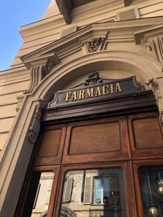 an old building with the name farmacia written on it's front door