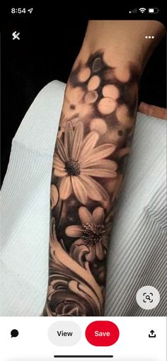 a woman's arm with flowers on it and the words, view save below