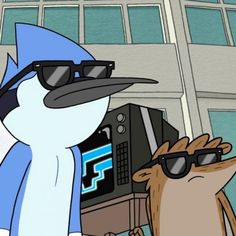 a cartoon penguin wearing sunglasses next to a computer monitor with the words regular show on it