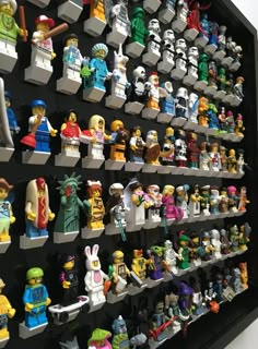 a wall full of lego minifigures on display