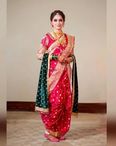 a woman in a red and green sari