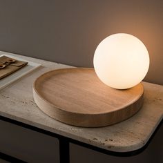 a wooden plate with a light on top of it