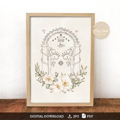 the digital embroidery pattern is displayed in a wooden frame on a table next to a white wall