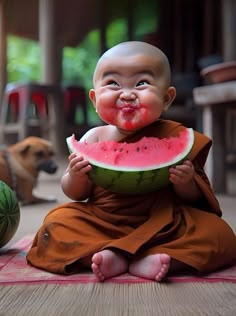 a little monk eating a piece of watermelon