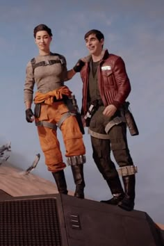 two people are standing on top of a building with an airplane in the sky behind them