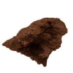 a brown sheepskin rug on a white background