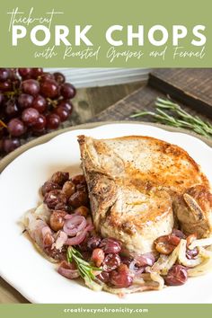 pork chops with roasted grapes and fennel on a white plate next to some red grapes