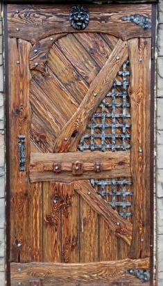 a wooden door with metal bars on it