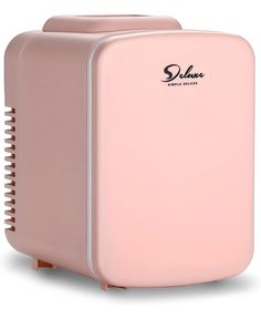 a pink portable air purificater sitting on top of a white surface