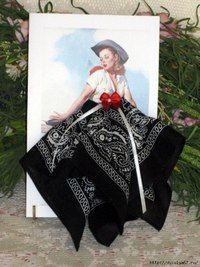 a card with an image of a woman wearing a hat and scarf on top of it