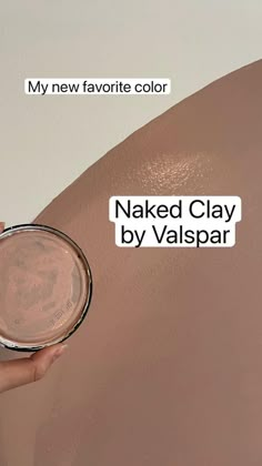 a person holding a powder in their hand and the words naked clay by valpspar on it