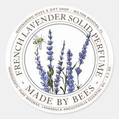 a round sticker with lavender flowers and a bee on the label that says french lavender solid